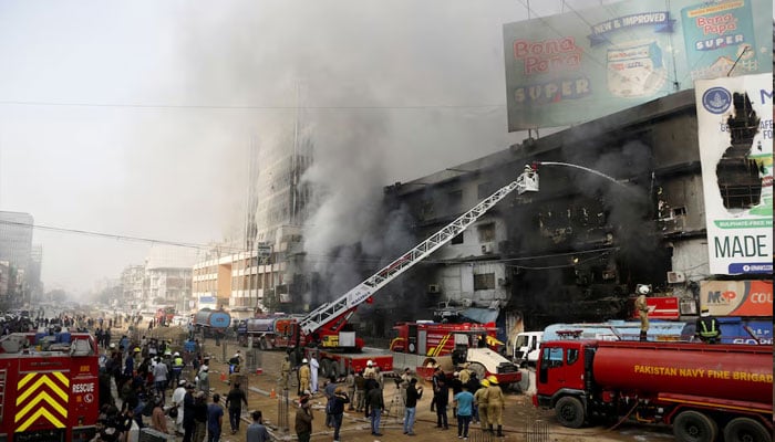 Smoke rises as firefighters spray water to extinguish a massive fire that broke out in the Gul Plaza Shopping Centre building, in Karachi, Pakistan, January 18, 2026. — Reuters