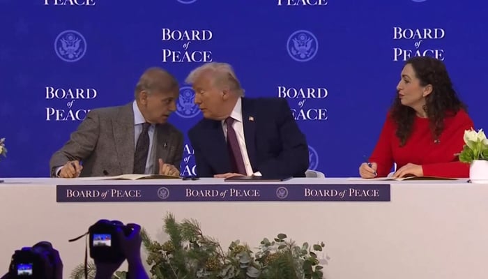 Prime Minister Shehbaz Sharif and President of Kosovo Vjosa Osmani sign Charter of the Board of Peace next to US President Donald Trump, as they take part in a charter announcement for his Board of Peace initiative alongside the 56th annual World Economic Forum (WEF), in Davos, Switzerland, January 22, 2026. — Reuters
