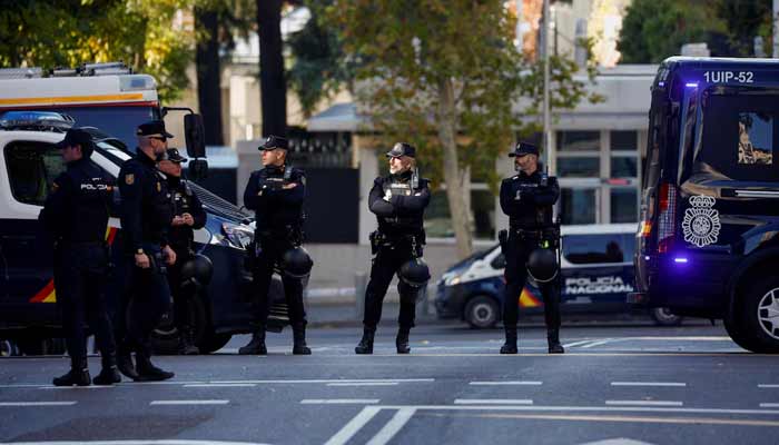 Police officers stand outside the US Embassy in Madrid. — Reuters/File
