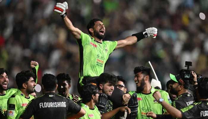 Lahore Qalanders players carry teammate Sikandar Raza as they celebrate after their victory in the Pakistan Super League (PSL) Twenty20 final cricket match between Lahore Qalandars and Quetta Gladiators at the Gaddafi Stadium in Lahore on May 25, 2025. — AFP