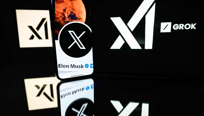 This photograph taken on January 13, 2025 in Toulouse shows screens displaying the logo of Grok, a generative artificial intelligence chatbot developed by xAI. — AFP/File