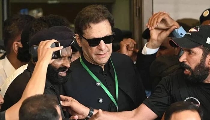 PTI founder Imran Khan leaves after appearing in the Supreme Court in Islamabad on July 24, 2023. — AFP