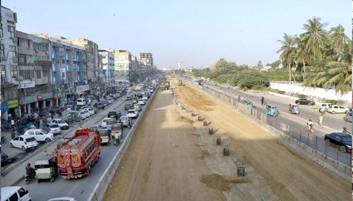 A view of the development work of Red Line is underway with the help of heavy machinery at University Road in the Provincial Capital. — APP/File