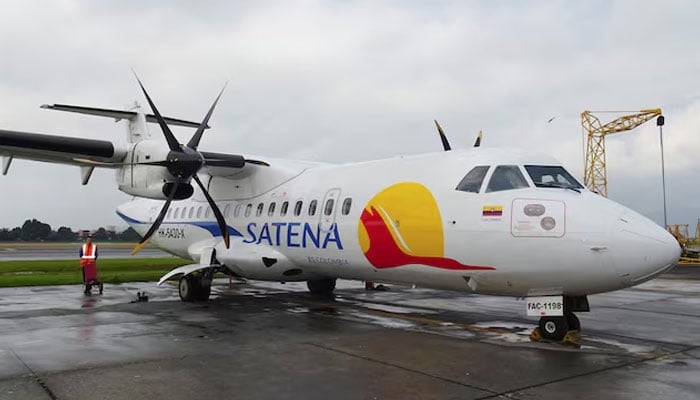 An ATR 72 twin-engine turboprop aircraft of Colombias state-run airline Satena sits outside the hangar, at El Dorado International Airport, in Bogota, Colombia, July 26, 2023. — Reuters