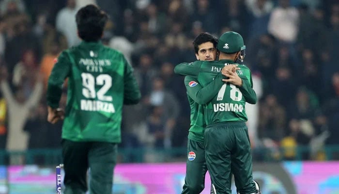 Pakistans Saim Ayub (centre) celebrates taking a wicket with teammates during their first T20I against Australia at the Gaddafi Stadium in Lahore on January 29, 2026. — PCB