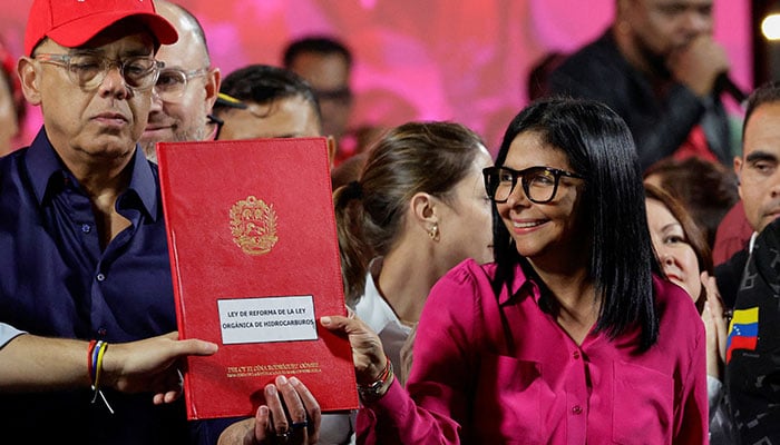 Venezuelas National Assembly President Jorge Rodriguez and Venezuelas interim President Delcy Rodriguez hold a copy of the new oil law reform during a protest held by Venezuelan oil workers in support of reforming the countrys main oil law and the release of ousted president Nicolas Maduro and his wife, Cilia Flores, at Miraflores Palace, in Caracas, Venezuela, January 29, 2026. — Reuters