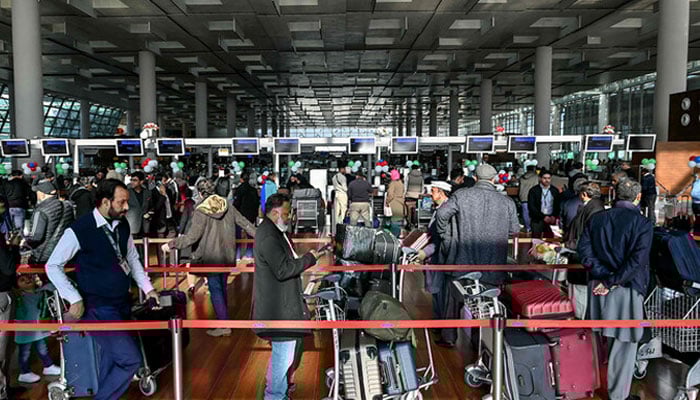Passengers wait at the immigration counter at the Islamabad International Airport on January 10, 2025.—  AFP