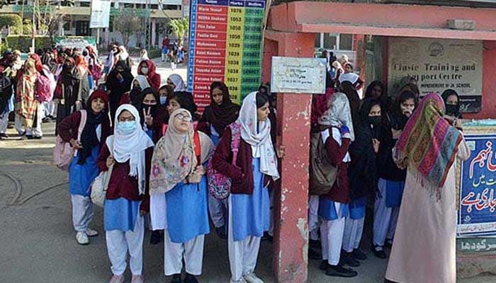 The picture shows students standing outside a school building. — Online/File