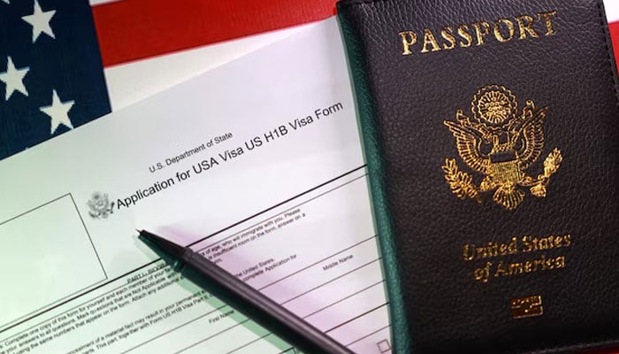 A US flag, a passport and a U.S. H-1B Visa application form are seen in this illustration taken, September 22, 2025. — Reuters