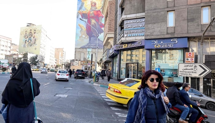 An Iranian woman walks along a street in Iranian capital Tehran on January 31, 2026. — AFP