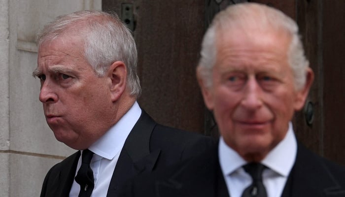 Britains Prince Andrew, Duke of York (L) and Britains King Charles III leave following a requiem mass, at Westminster Cathedral in London on September 16, 2025. — AFP