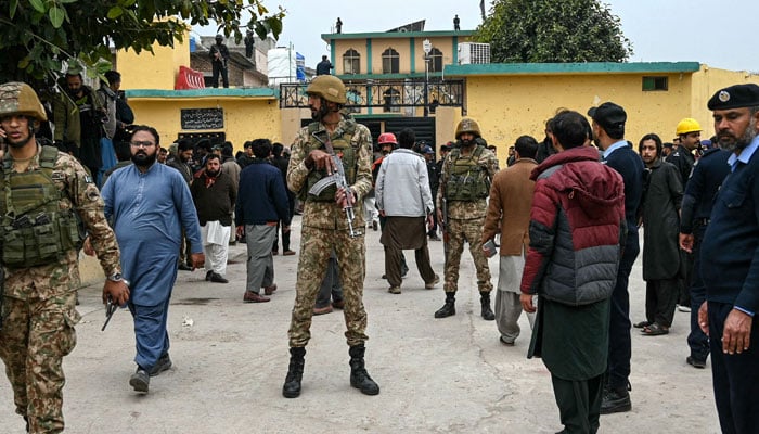 Security personnel stand guard outside a mosque following an explosion, in Islamabad on February 6, 2026. — AFP