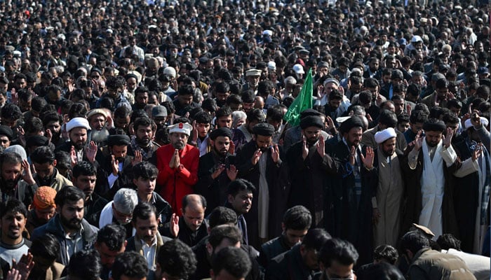 People gather to attend the funeral of the victims following the suicide explosion at an imambargah in Islamabad on February 7, 2026. — AFP