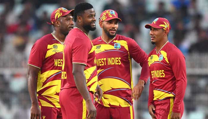 Romario Shepherd celebrates with team mates after dismissing Brandon McMullen during the ICC Mens T20 World Cup match against Scotland at Eden Gardens on February 07, 2026 in Kolkata, India. — AFP