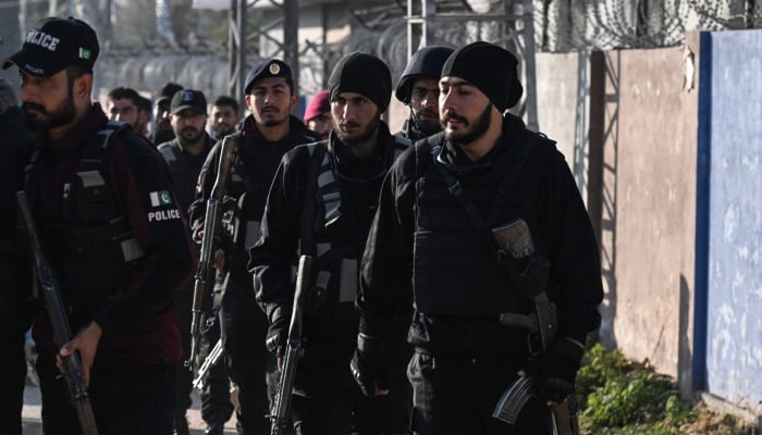 Security personnel stand guard near the cordoned Khadijah al-Kubra Imambargah in Islamabad, February 7, 2026. — AFP