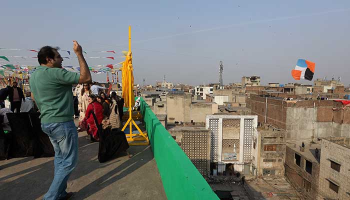 A man flies a kite from a rooftop to mark Basant, a kite-flying festival, in Lahore on February 6, 2026. — Reuters