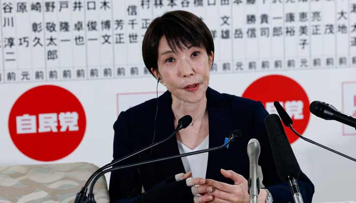 Japans Prime Minister Sanae Takaichi speaks to the media in front of a board displaying the names of LDP candidates at the LDP headquarters on general election day in Tokyo, Japan, February 8, 2026.— Reuters
