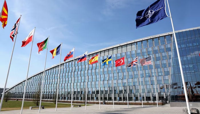 National flags of NATO members flutter at the alliances headquarters in Brussels, Belgium, April 2, 2025. — Reuters