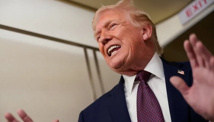US President Donald Trump speaks with members of the media aboard Air Force One en route from Florida to Washington, US, January 11, 2026. — Reuters