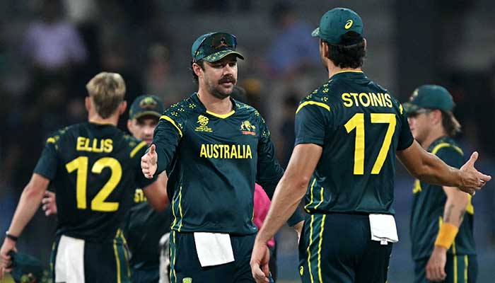 Australias captain Travis Head (C) celebrates with teammates their teams win at the end of the 2026 ICC Mens T20 Cricket World Cup group stage match between Ireland and Australia at R Premadasa Stadium in Colombo on February 11, 2026. — AFP