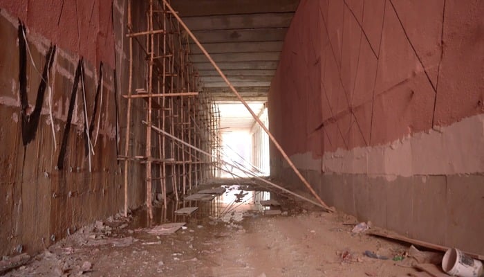 Construction work continues at the Meena Bazaar underpass in Karachis Karimabad. — Reporter