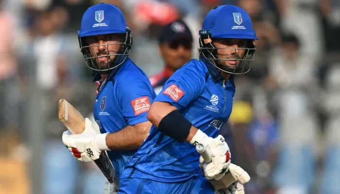 Justin Mosca (right) and Anthony Mosca run between the wickets during the 2026 ICC Mens T20 Cricket World Cup group stage match between Nepal and Italy at the Wankhede Stadium in Mumbai on February 12, 2026. — AFP