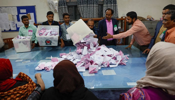 An electoral worker empties a ballot box as vote counting begins, during the 13th general election in Dhaka, Bangladesh, February 12, 2026. — Reuters