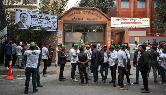 Bangladesh Nationalist Party (BNP) supporters gather outside a polling station where BNP leader Tarique Rahman was set to cast his vote, ahead of the polls opening for Bangladesh´s general election in Dhaka on February 12, 2026. — AFP