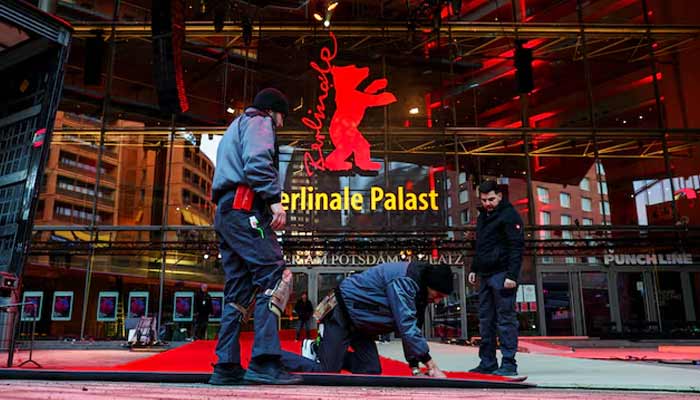 Workers lay the red carpet at the Berlinale Palast for the upcoming Berlinale International Film Festival in Berlin, Germany, February 10, 2026.— Reuters
