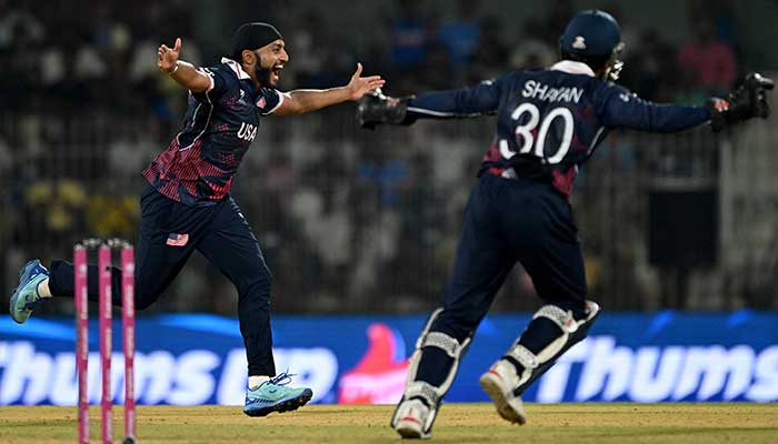 USAs Harmeet Singh (L) celebrates after taking the wicket of Netherlands Bas de Leede during the 2026 ICC Mens T20 Cricket World Cup group stage match between Netherlands and USA at MA Chidambaram Stadium in Chennai on February 13, 2026. — AFP