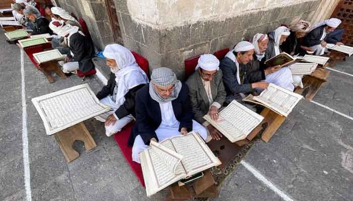 People read the Quran at the Grand Mosque ahead of the fasting month of Ramadan in Sanaa, Yemen, March 22, 2023. — Reuters