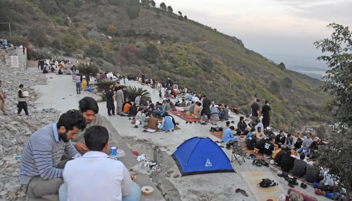 A large number of people are having the Iftar at Margalla Hills, in Islamabad, March 23, 2025. — Online