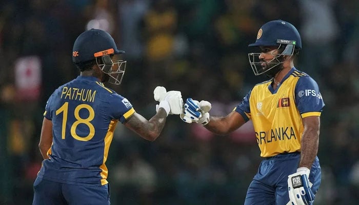 Sri Lankas Pathum Nissanka (left) and Pavan Rathnayake bump fists during their ICC Mens T20 World Cup match against Australia at the Pallekele International Cricket Stadium in Pallekele on February 16, 2026. — ICC