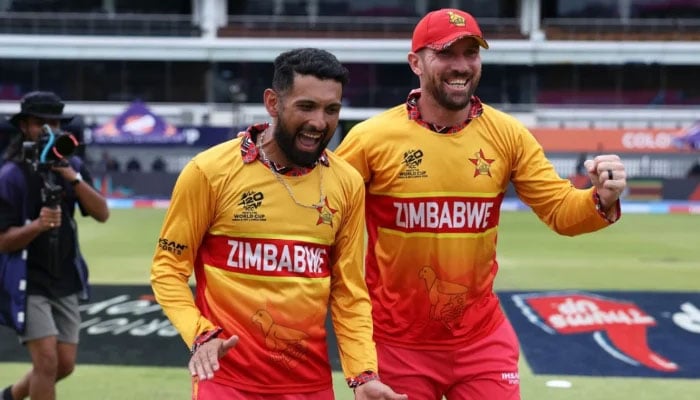 Zimbabwes captain Sikandar Raza (left) celebrates with Brendan Taylor after his teams win in the 2026 ICC Mens T20 Cricket World Cup group stage match against Australia at the R Premadasa Stadium in Colombo on February 13, 2026. — AFP