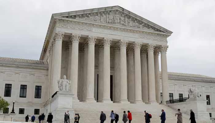 People walk across the plaza of the US Supreme Court building on the first day of the courts new term in Washington, US.— Reuters