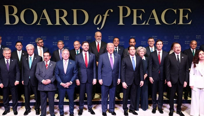 US President Donald Trump stands with world leaders participating in the inaugural Board of Peace meeting at the US Institute of Peace in Washington DC, February 19, 2026. — Reuters