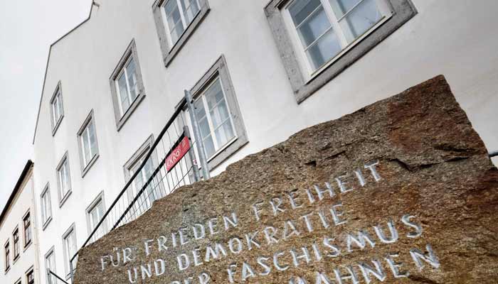 Picture taken on February 17, 2026 shows a memorial stone reading For Peace, Freedom and Democracy - Never Again Fascism - Millions of Dead Warn in front of the birth house of former German dictator Adolf Hitler that is turned into a police station, in Braunau am Inn, Austria.— AFP