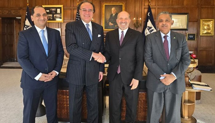 Finance Minister Muhammad Aurangzeb (second from left) shakes hand with US Commerce Secretary Howard A Lutnick as the two meet at the Department of Commerce in Washington. — X/ @Financegovpk