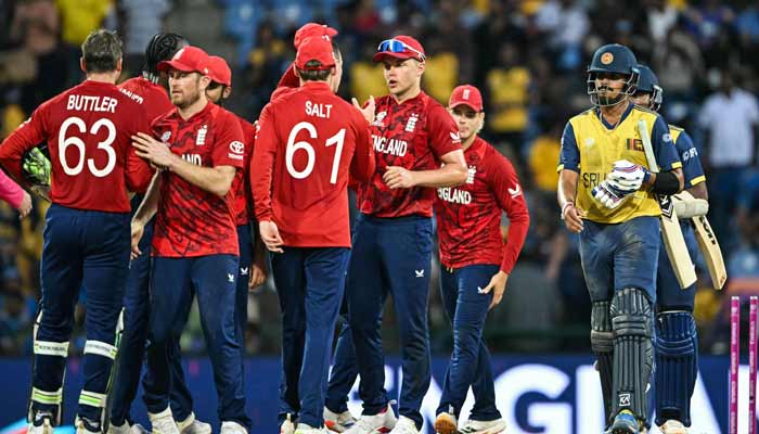 Englands players celebrate their teams win against Sri Lanka at the end of their 2026 ICC Mens T20 Cricket World Cup Super Eights match in the Pallekele International Cricket Stadium, Kandy on February 22, 2026.— AFP