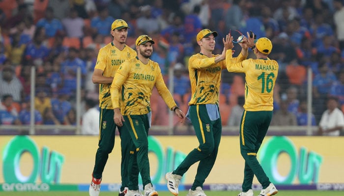 South Africas Keshav Maharaj celebrates with teammates after taking the wicket of Indias Arshdeep Singh, caught out by Tristan Stubbs on February 22, 2026. — Reuters
