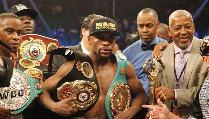 Floyd Mayweather, Jr poses with his title belts after defeating Manny Pacquiao in Las Vegas, US on May 3, 2015. — Reuters