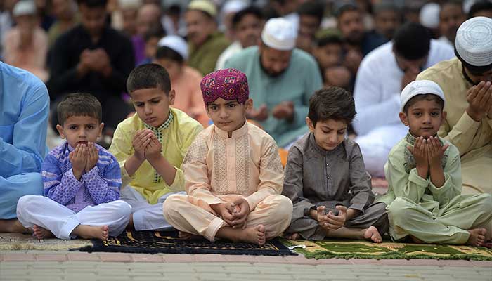 Muslims offer prayers during Eid al-Fitr at the Eidgah Sharif Darbar in Rawalpindi on June 5, 2019. — AFP