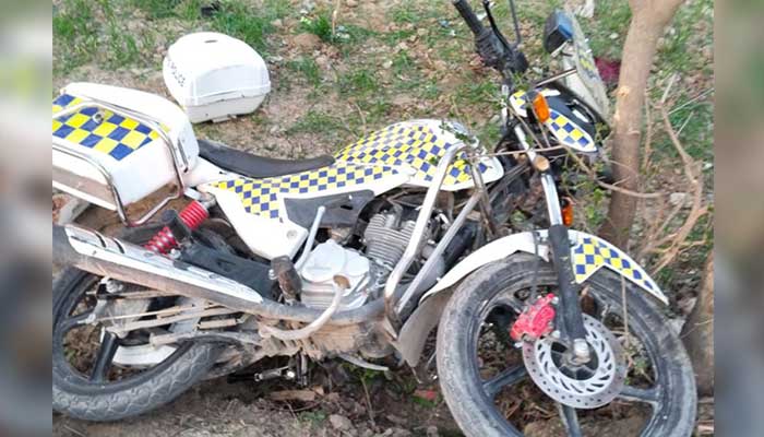 A motorcycle used by Ababeel Force personnel lies damaged at the attack site following a gun assault in Bajaur district, Khyber Pakhtunkhwa, on February 25, 2026. — Reporter