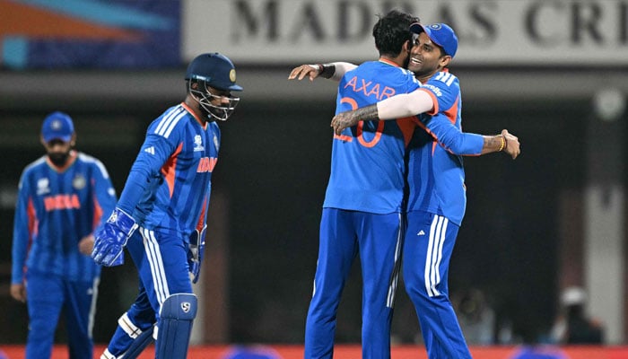 India´s captain Suryakumar Yadav (right) congratulates teammate Axar Patel (second right) after the wicket of Zimbabwe´s Tadiwanashe Marumani during the 2026 ICC Mens T20 Cricket World Cup Super Eights match between India and Zimbabwe at the MA Chidambaram Stadium in Chennai on February 26, 2026.