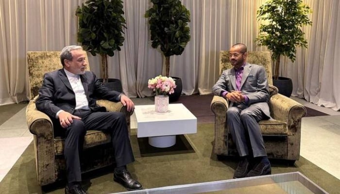 Iran’s Foreign Minister Abbas Araghchi speaks with his Omani counterpart Badr Albusaidi during their meeting in Geneva on Feb. 26, 2026. — AFP