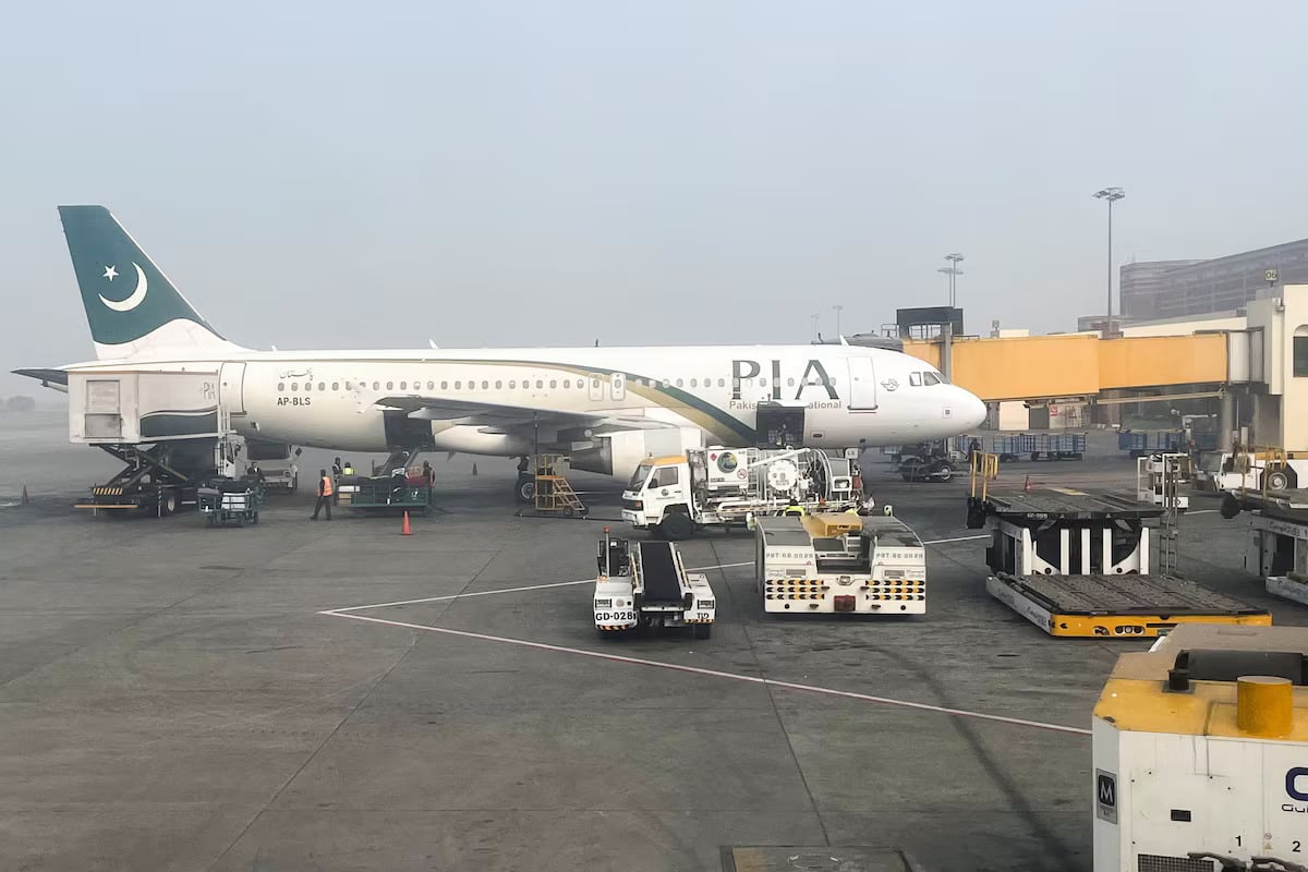 View of a Pakistan International Airlines (PIA) passengers plane, taken through a glass panel, at the Allama Iqbal International Airpor in Lahore, Pakistan January 29, 2024. — Reuters