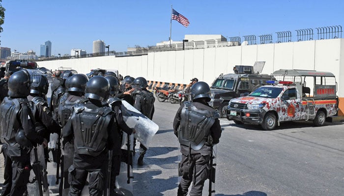 Security personnel stand outside the US Consulate General in Karachi on March 4, 2026. — Online