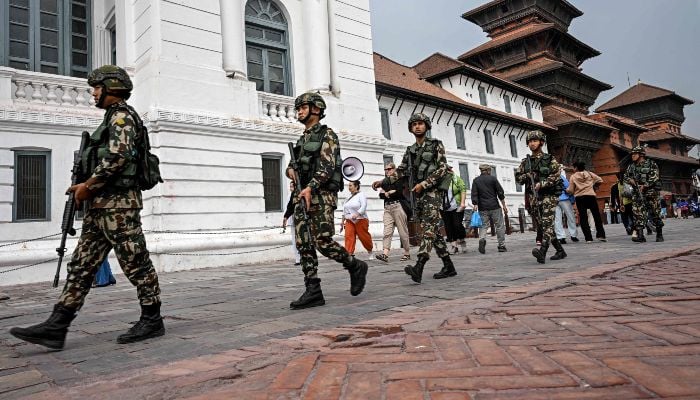 Nepal Army personnel patrol a street on the eve of Nepals parliamentary elections in Kathmandu on March 4, 2026. — AFP