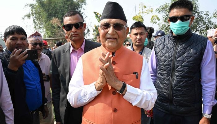 Khadga Prasad Sharma Oli (C), Nepals former prime minister and Communist Party of Nepal-Unified Marxist Leninist (CPN-UML) leader, greets supporters during a rally on the final day of campaigning ahead of the countrys general election at Gauradaha in Jhapa district on March 2, 2026. — AFP