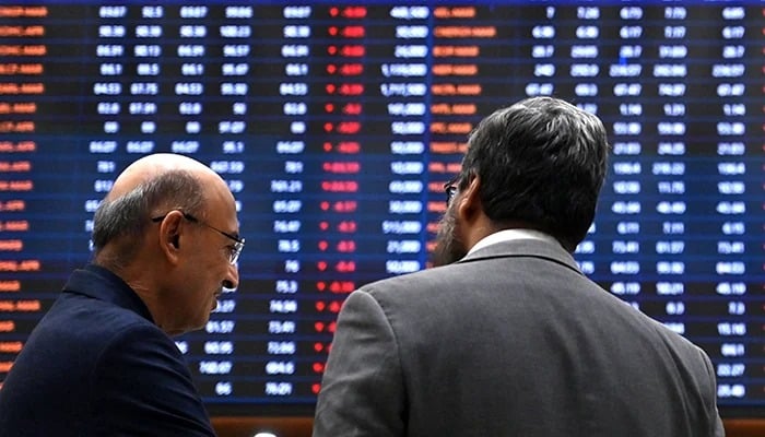 Stockbrokers react while monitoring share prices at the Pakistan Stock Exchange (PSX) in Karachi on March 2, 2026. — AFP
